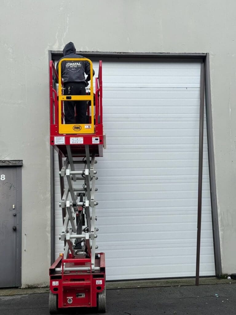 A man working on a door